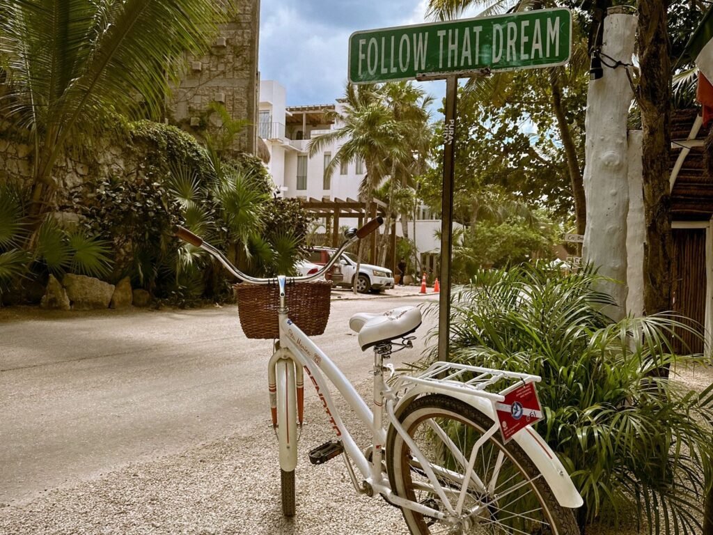 White rental bike on a street in Tulum, Mexico